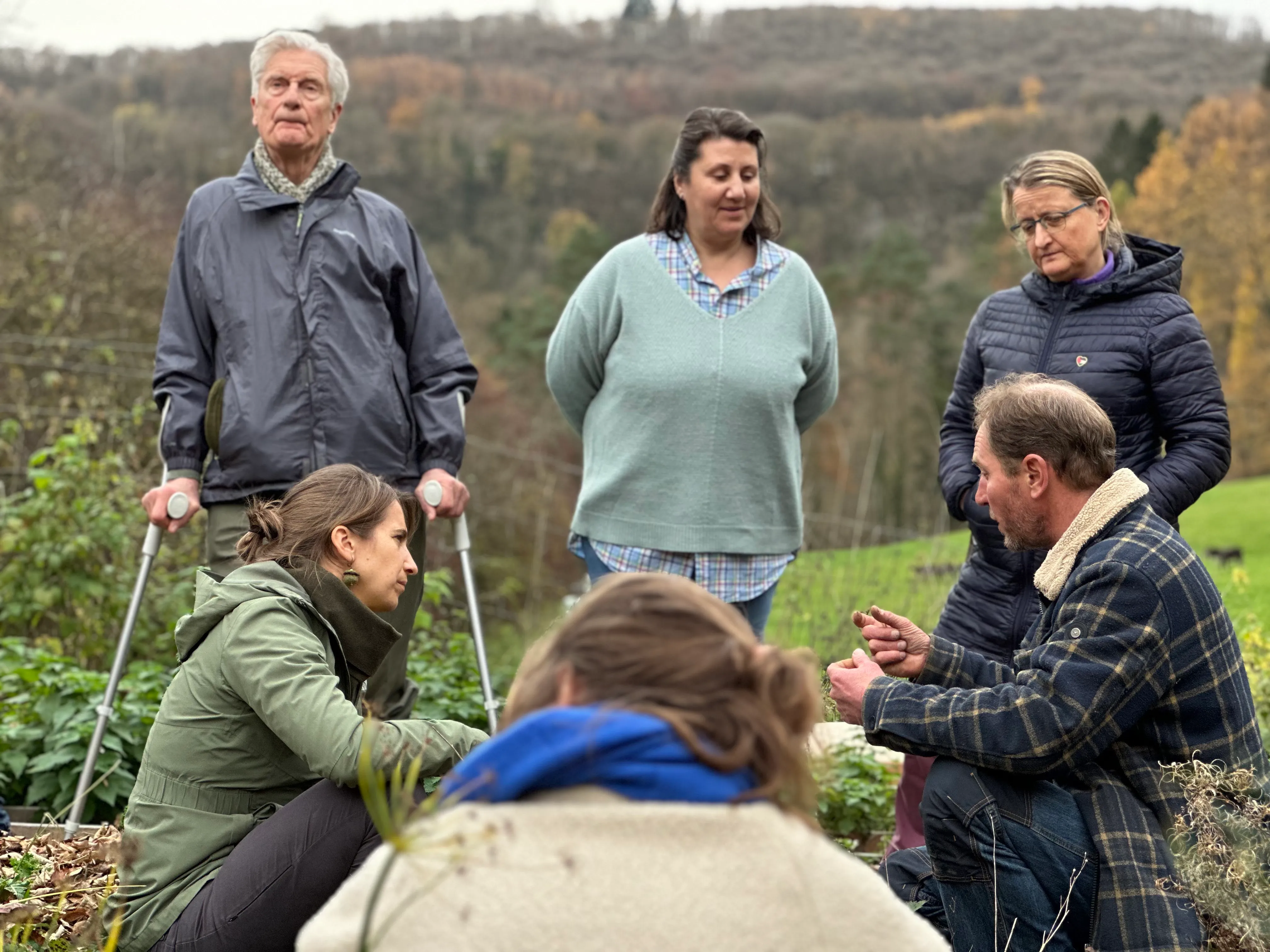 Participants examining soil samples during a living-soil analysis workshop