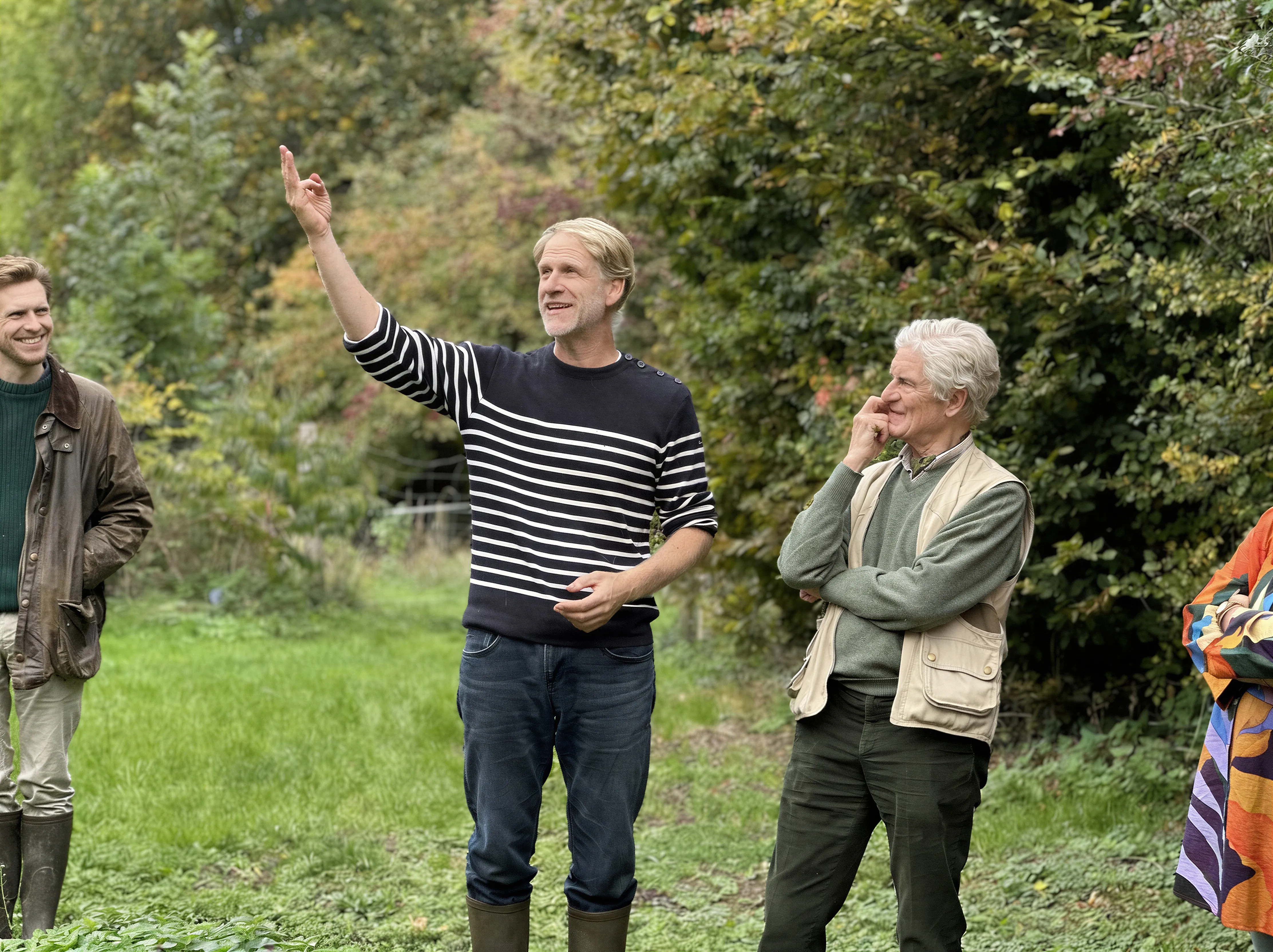 Alec de Selliers listening to a trainer's explanations in a food forest in autumn